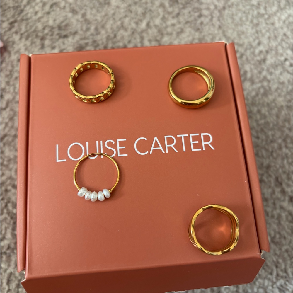 Four Louise Carter gold rings